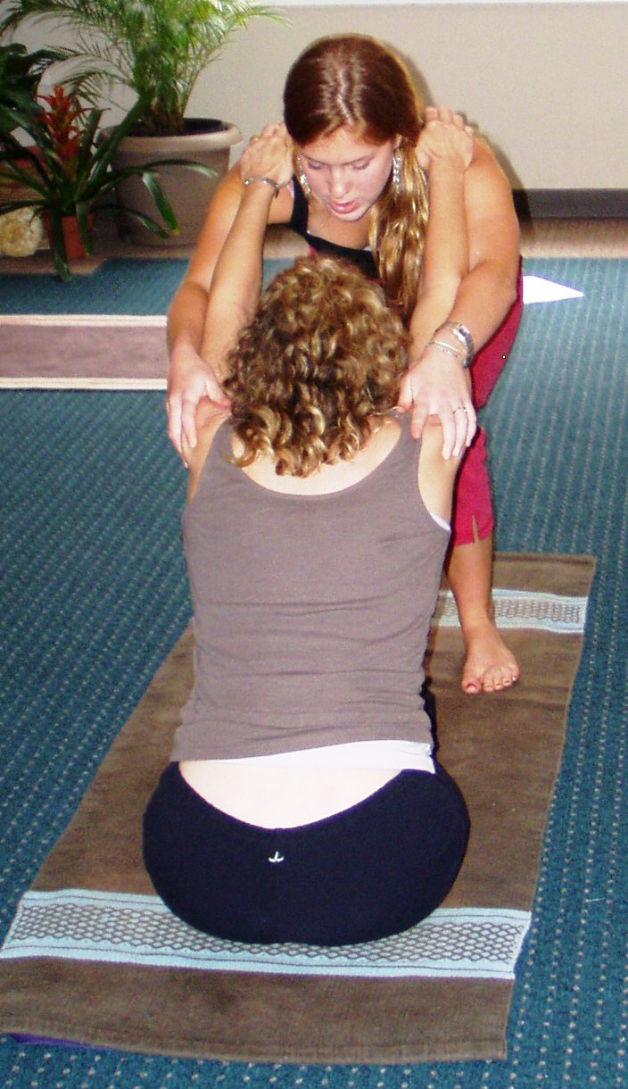 Anna assists Paschimottanasana