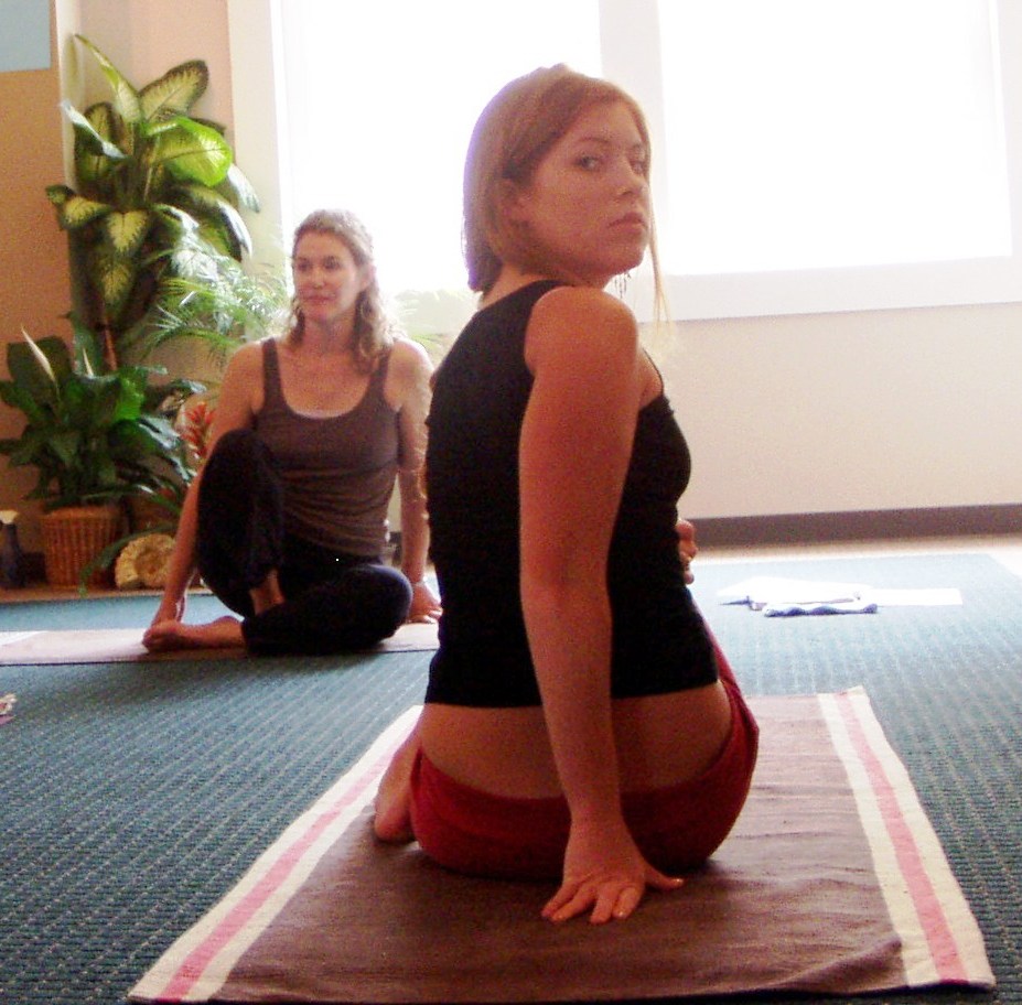 Kate guies Anna in Matsyendrasana
