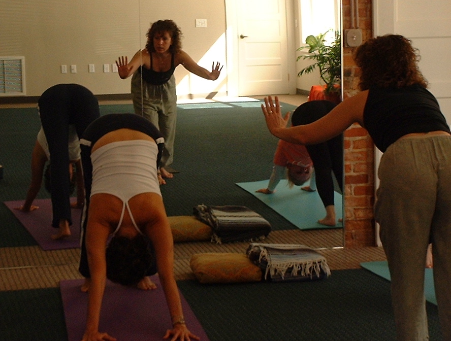 Kathy leads downward dog