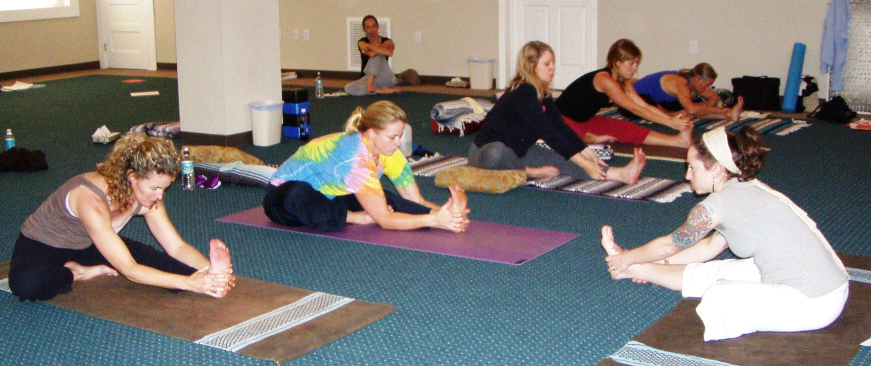 Kristen guides Janu Shirshasana